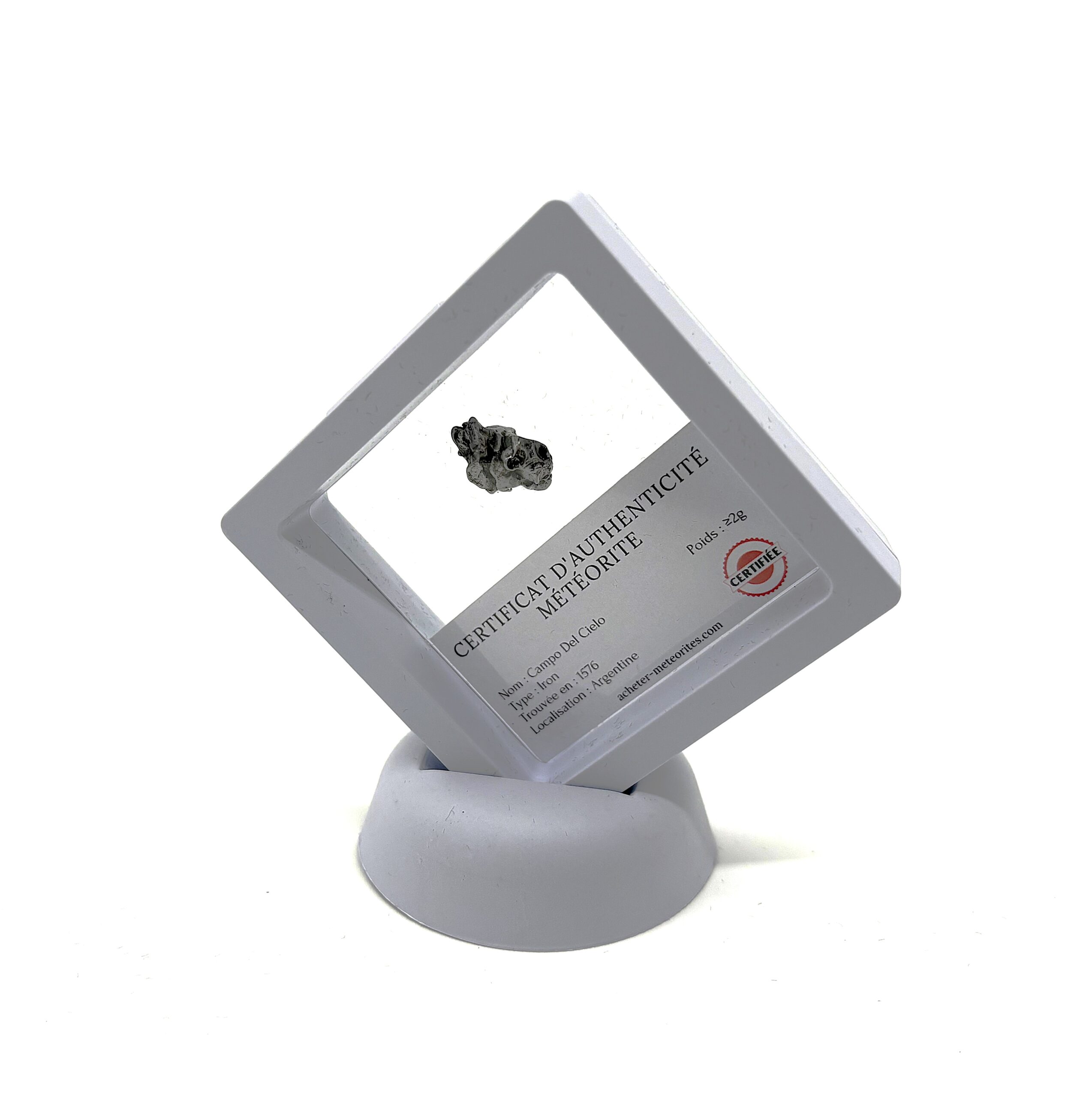 Regalo meteorito Campo del Cielo en marco de plástico blanco transparente - mínimo 1 g
